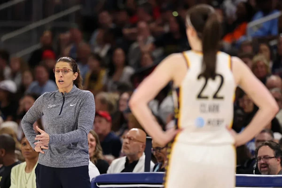 Coach instructing player during basketball game