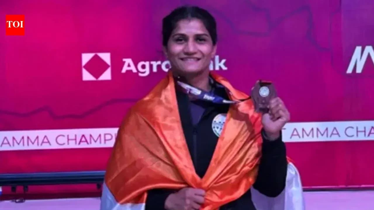 Athlete celebrating with medal and national flag