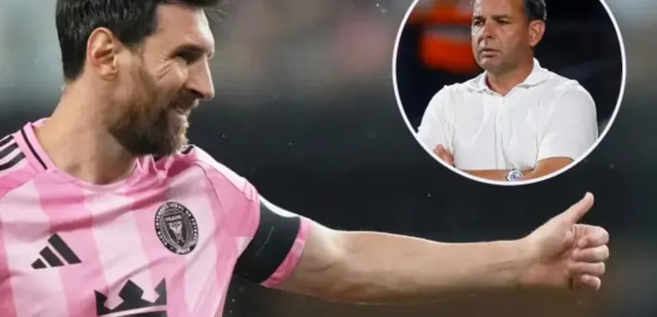 Lionel Messi celebrating with coach in background