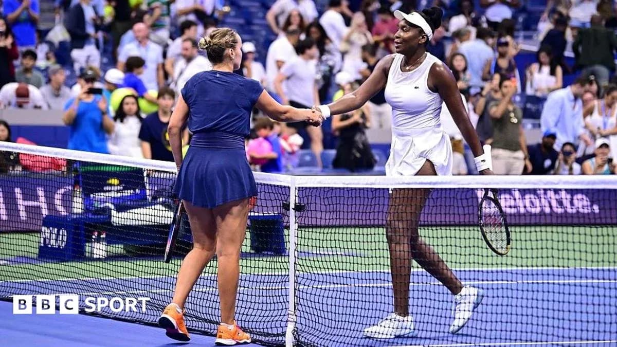 Players shaking hands at the net after match