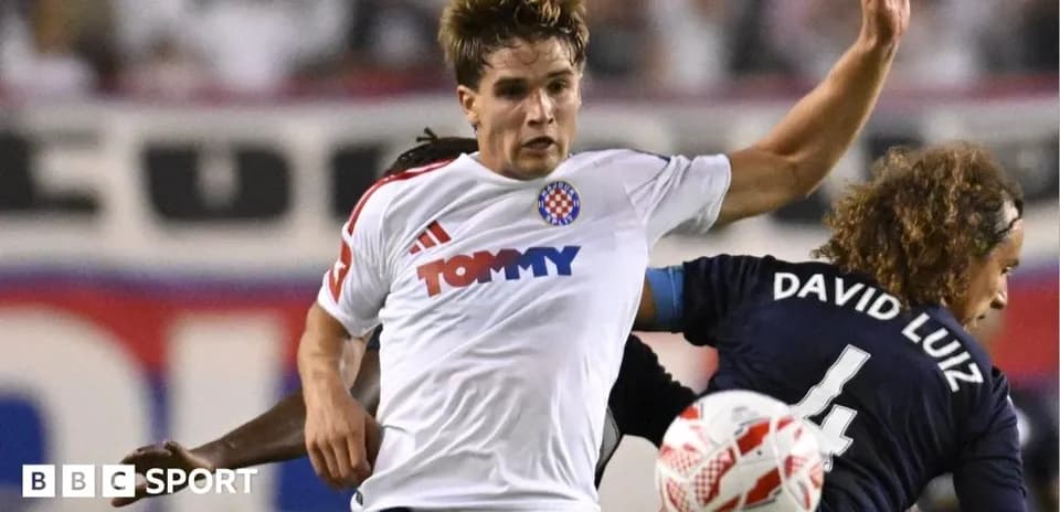 Player in white shirt challenging for the ball