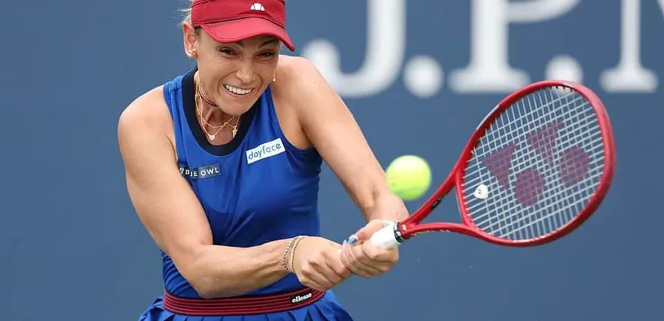 Player hitting a tennis ball during a match