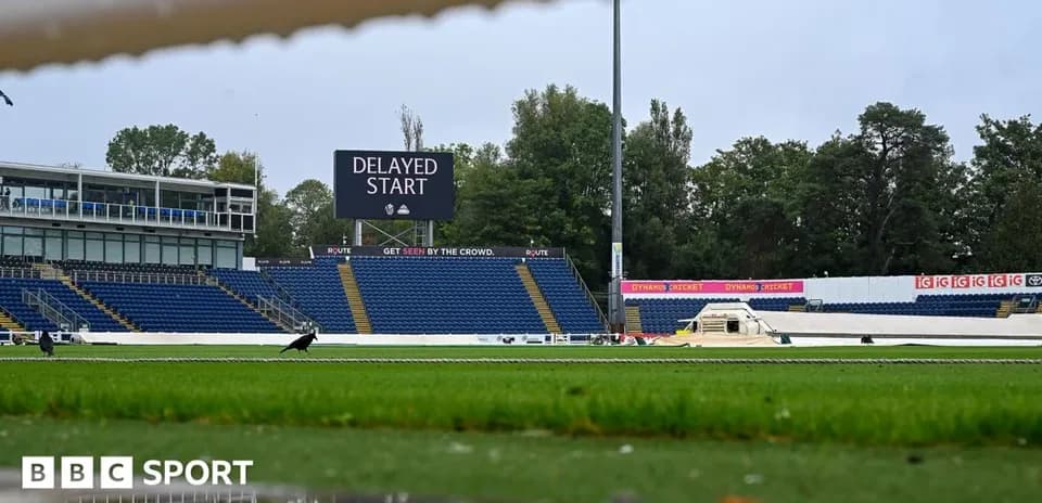 Cricket ground showing delayed start announcement board