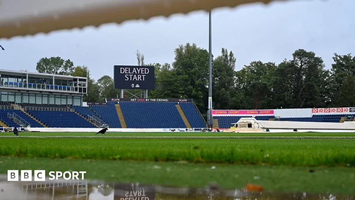 Cricket ground showing delayed start announcement board