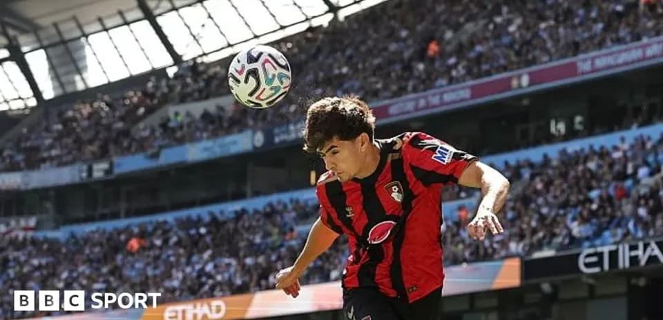 Bournemouth player heading ball during match