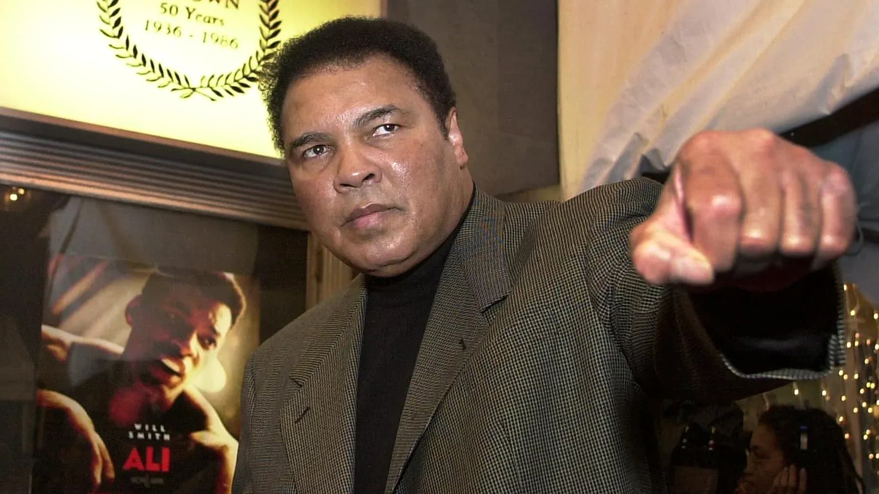 Muhammad Ali posing with a raised fist