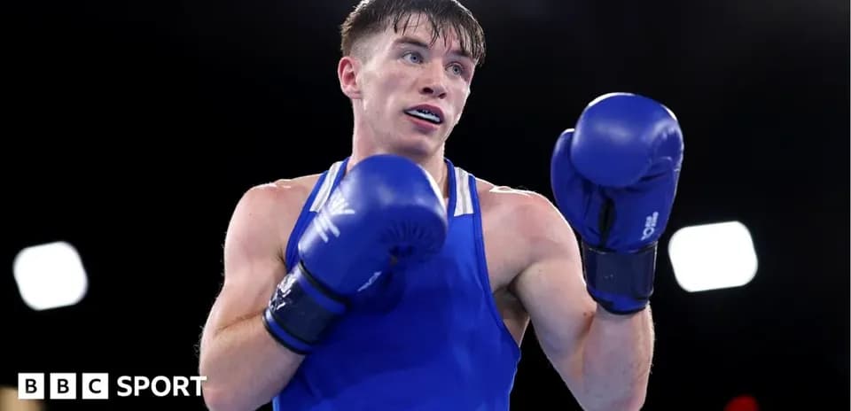 Boxer in blue gloves preparing for match