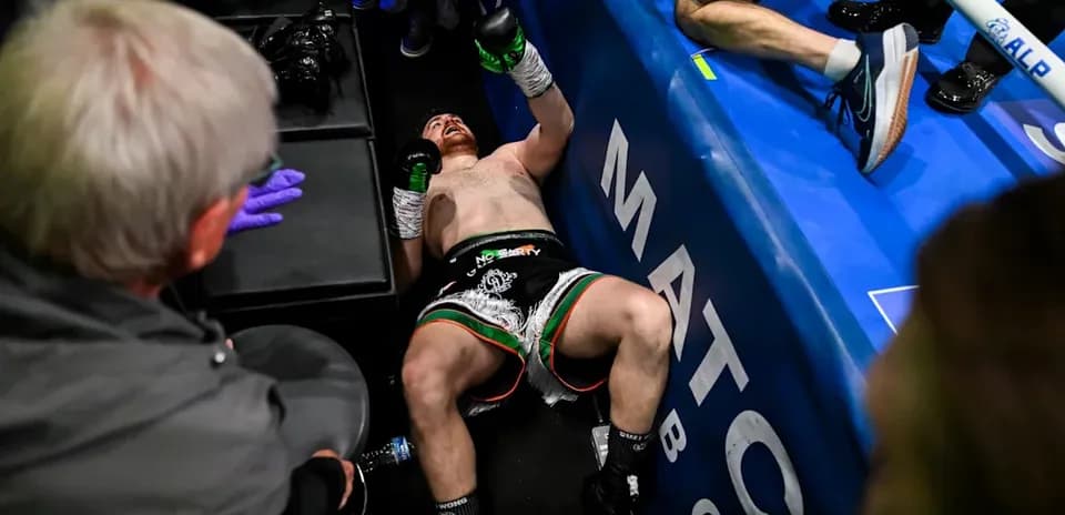 Boxer lying on the floor after match conclusion
