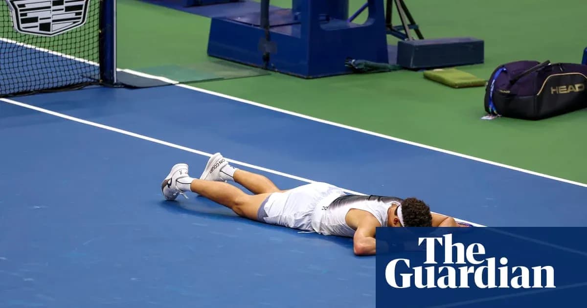 Player lying on tennis court after match loss