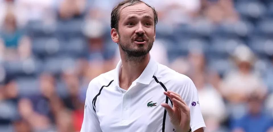 Tennis player gesturing during a match