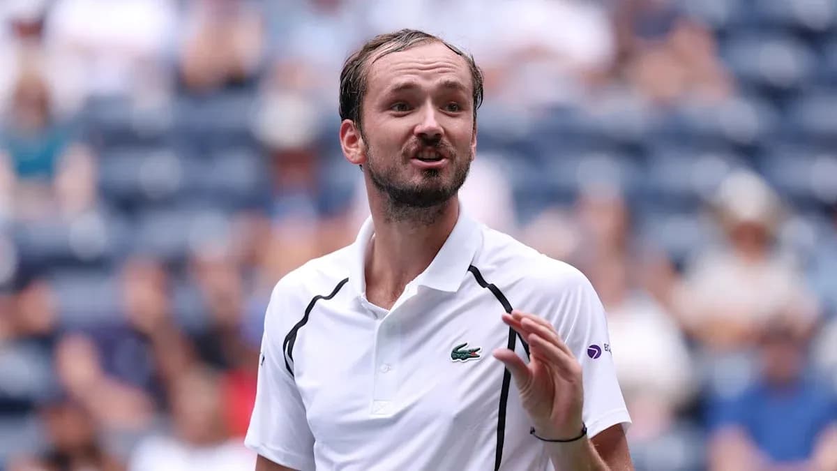 Tennis player gesturing during a match