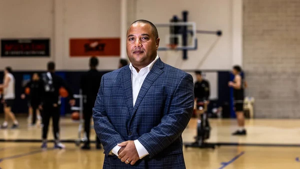 Coach standing confidently on basketball court