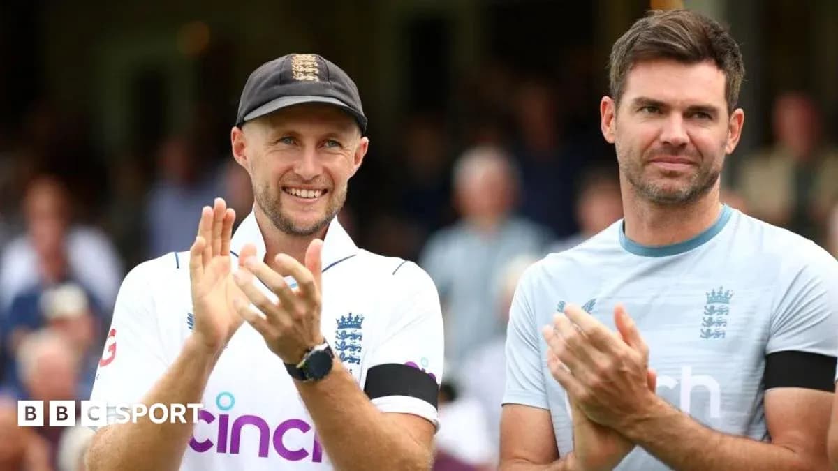 Two England cricketers applauding on the field