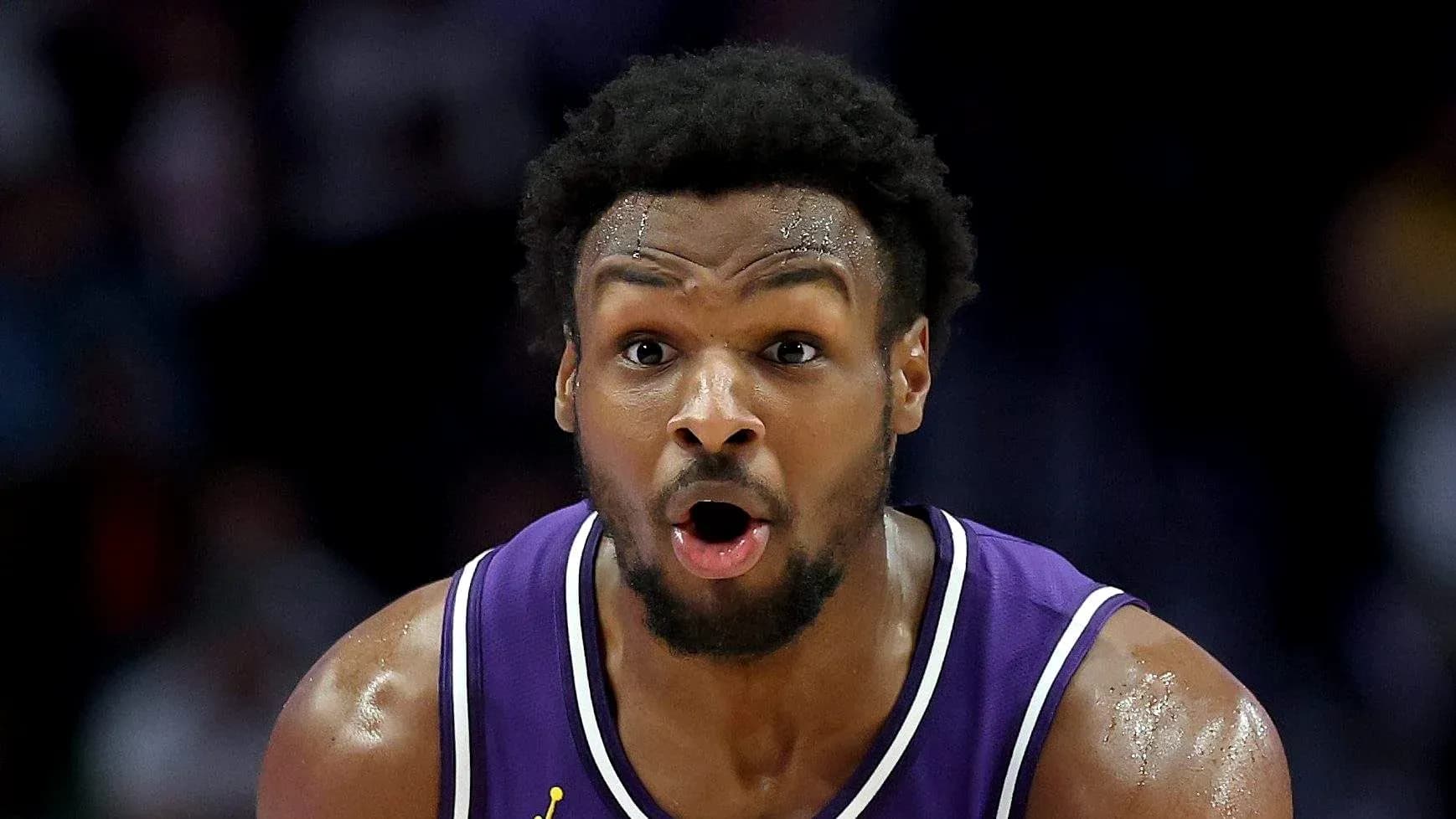 Basketball player in purple jersey during game