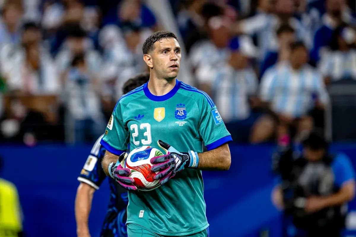 Goalkeeper holding ball during match at stadium