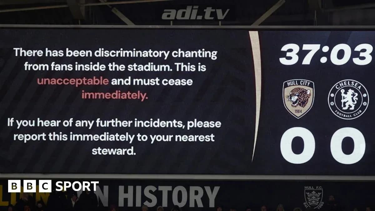 Stadium screen showing warning about discriminatory chanting