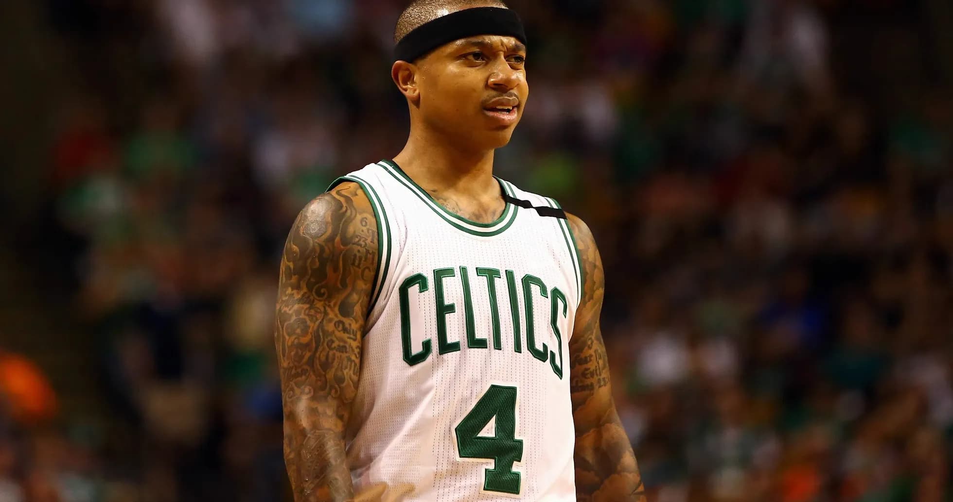 Basketball player in Celtics uniform on court