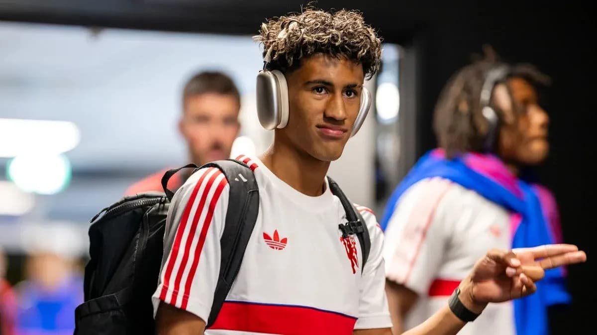 Player wearing headphones walking in team tunnel