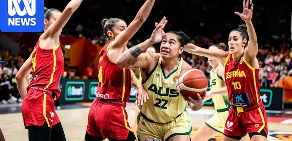 Player 22 from Australia driving towards the basket