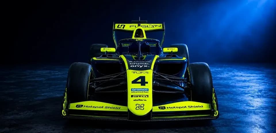 Race car with yellow and black design on display