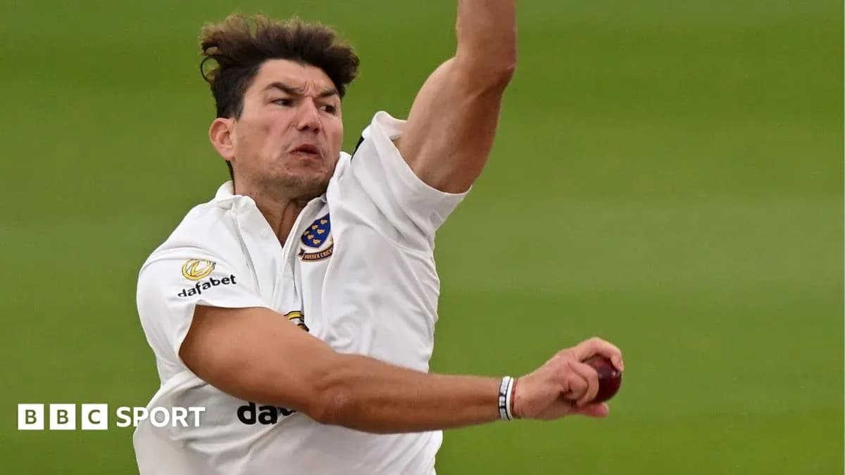 Cricketer bowling during a match