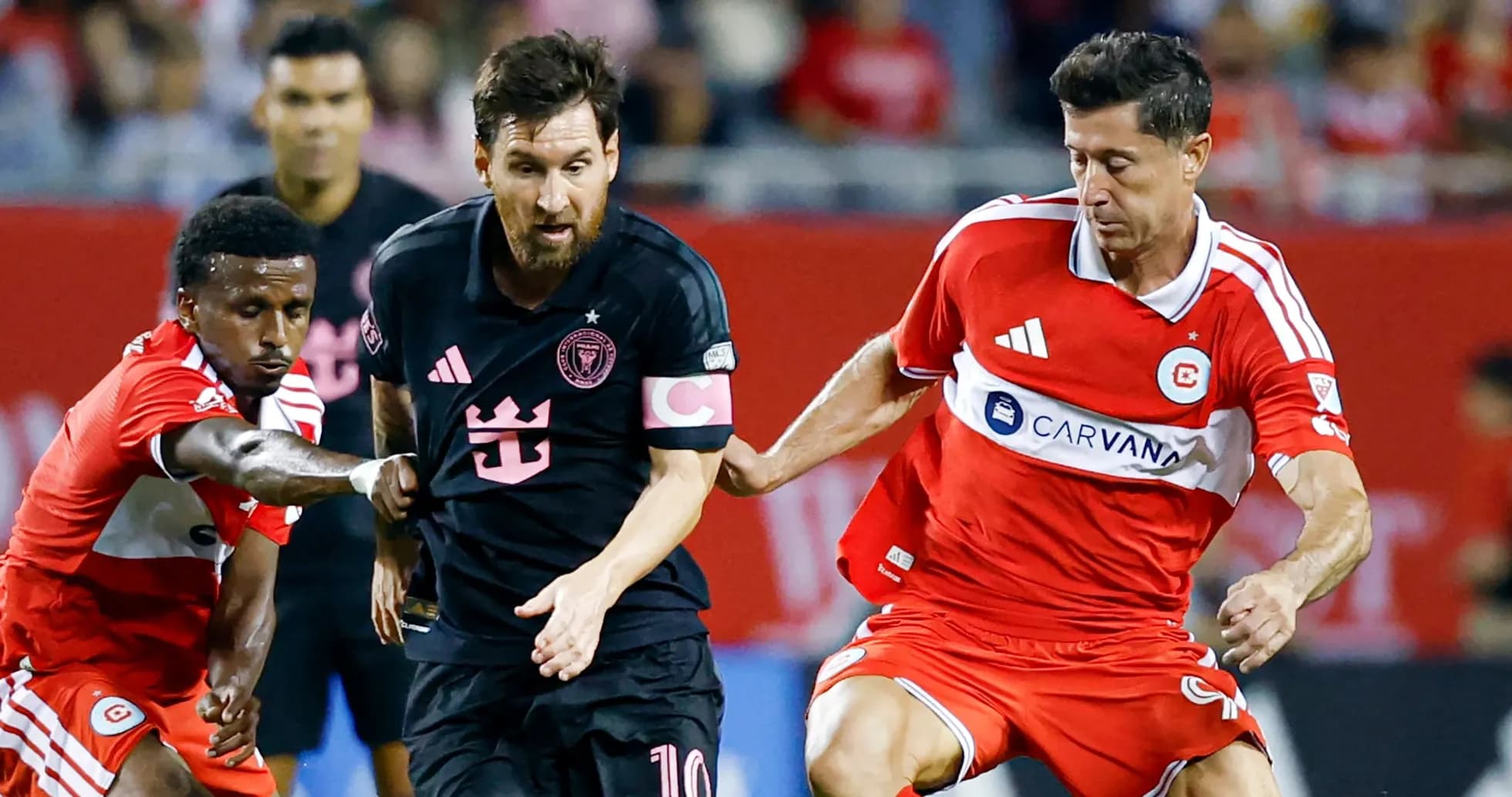 Players battling for the ball during soccer match