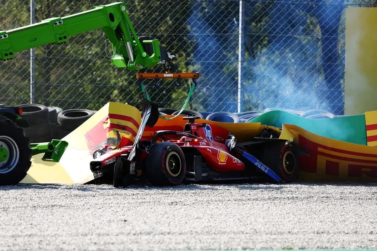 Crushed Ferrari car being lifted by a crane