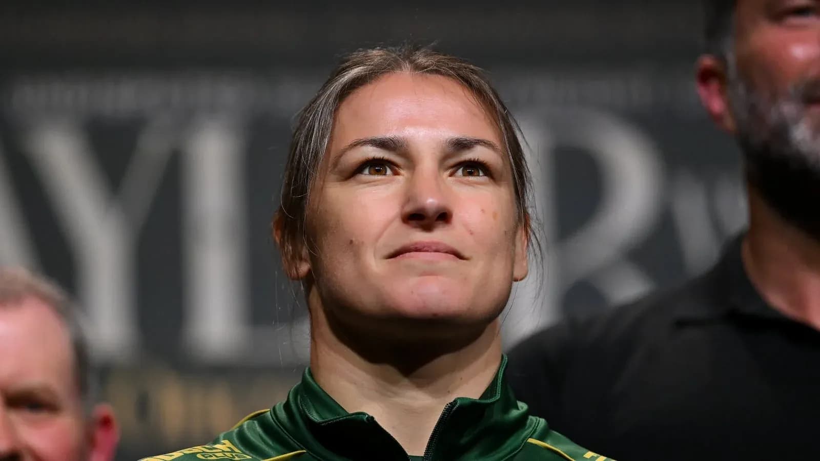 Female athlete with serious expression at event