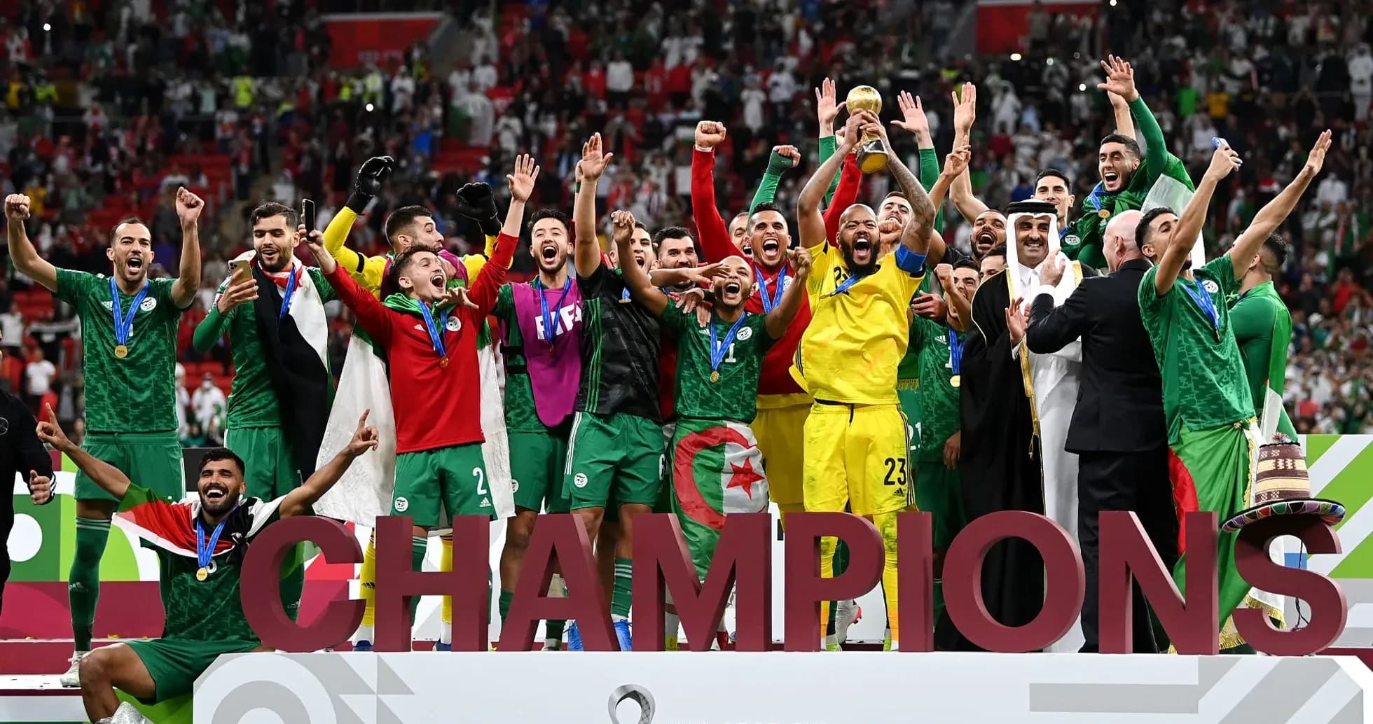 Algerian team celebrating victory with trophy
