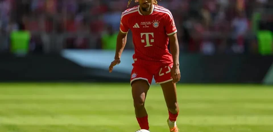 Player dribbling ball on field during match