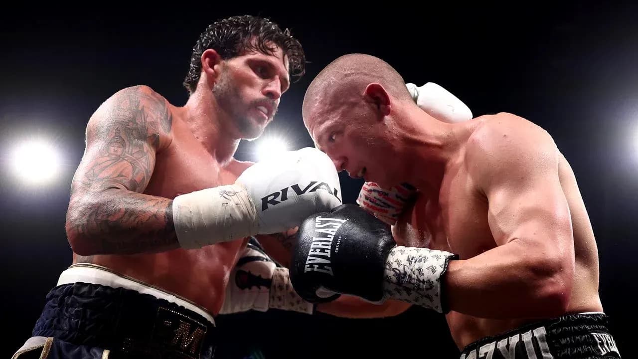 Two boxers exchanging punches in the ring