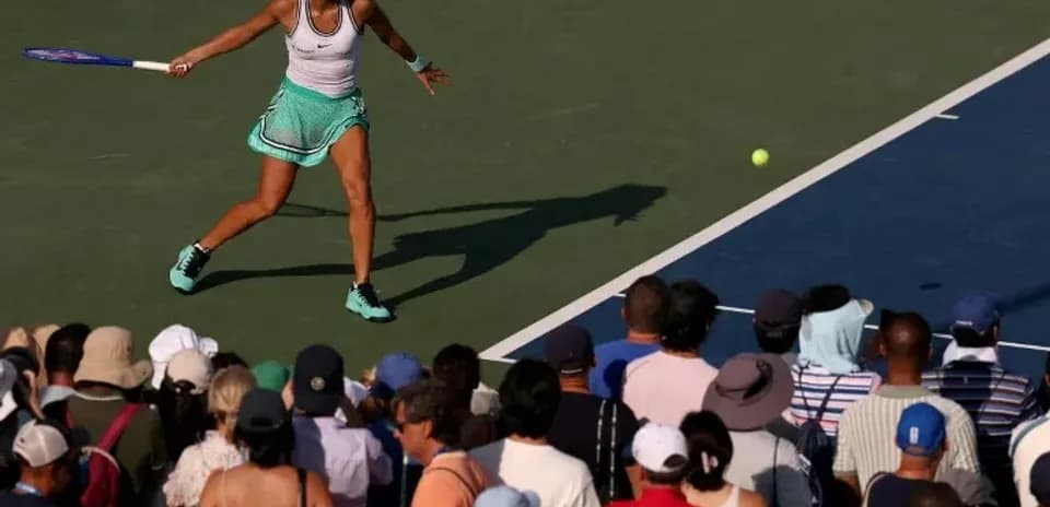 Female tennis player hitting a forehand shot