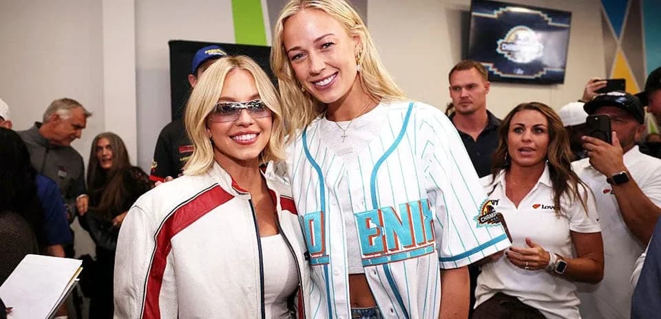 Two women posing together at an event