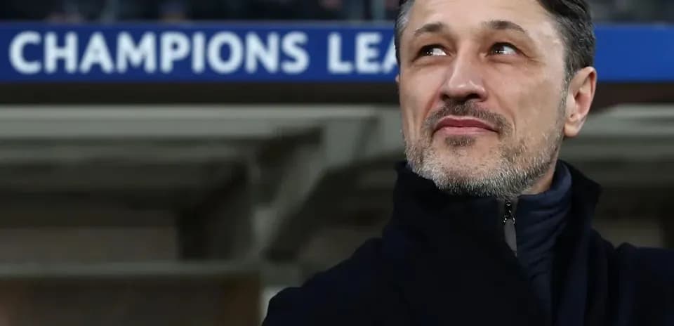 Coach observing match during Champions League event
