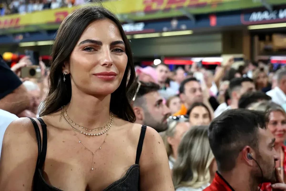 Woman smiling among a crowd at an event