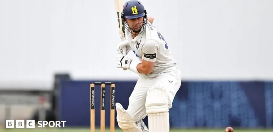 Batsman preparing to hit ball during cricket match