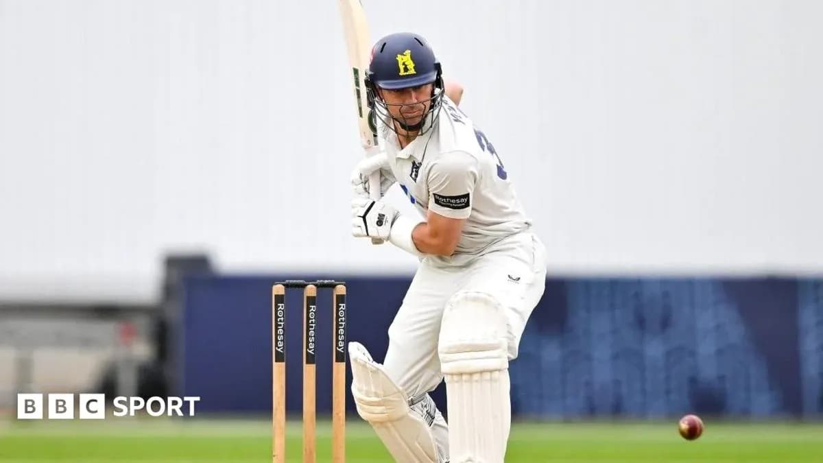 Batsman preparing to hit ball during cricket match