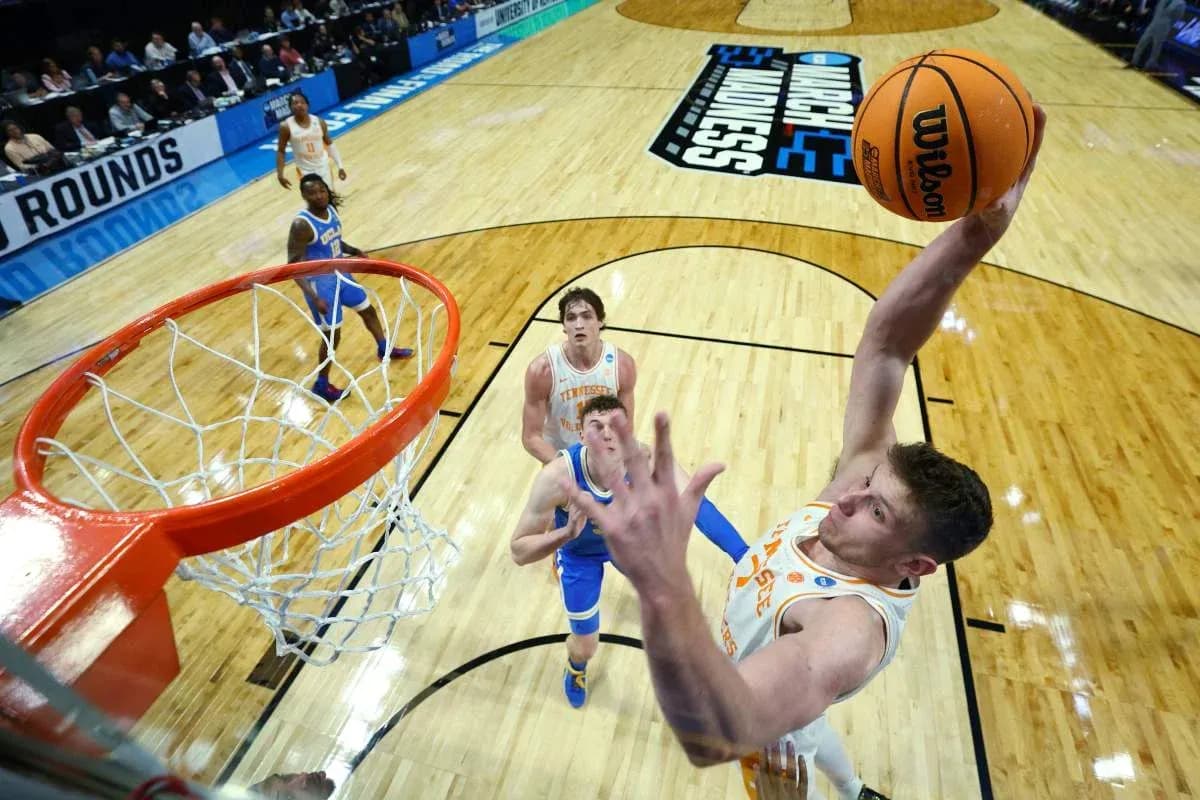 Player dunking during NCAA basketball tournament game