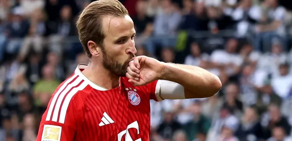 Player celebrating by kissing his wrist during match