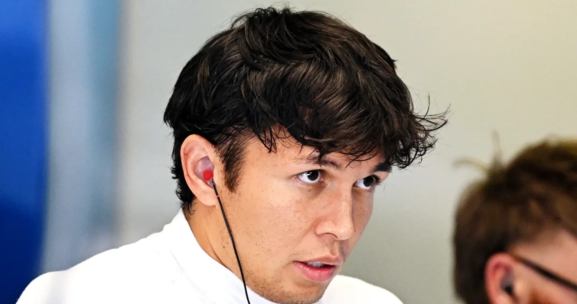 Driver focused during a team meeting with headphones
