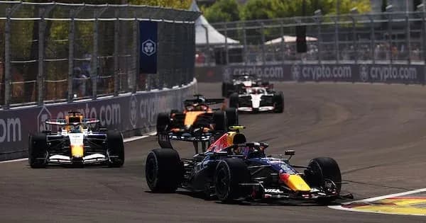 Formula 1 cars racing on street circuit track