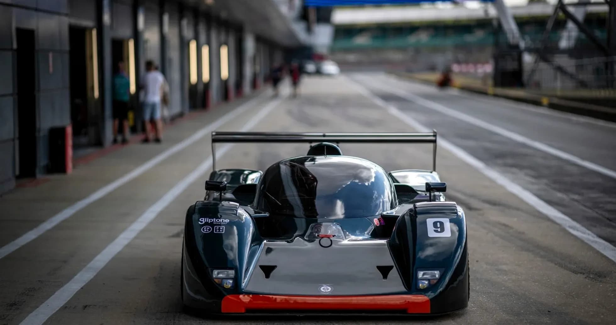 Race car in the pit lane at a racetrack