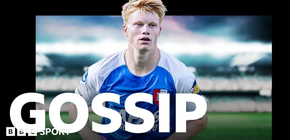 Player in blue and white kit on football pitch