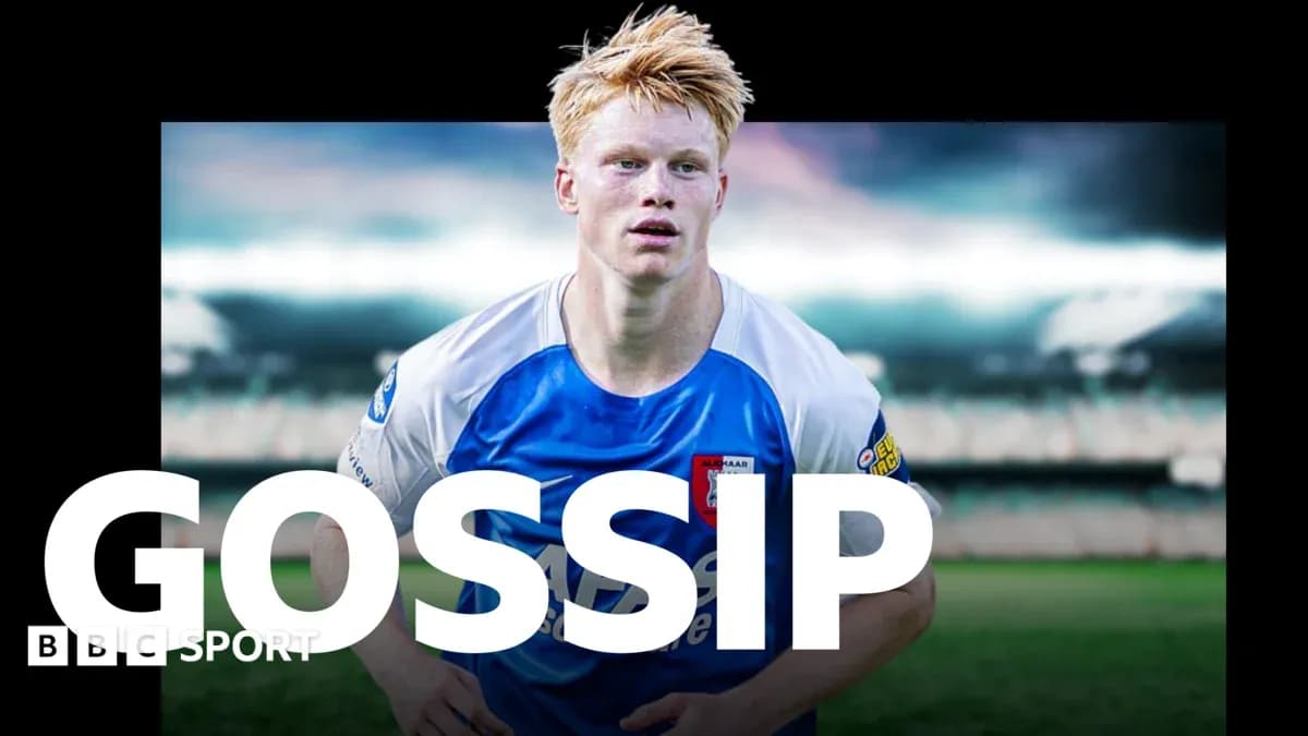 Player in blue and white kit on football pitch
