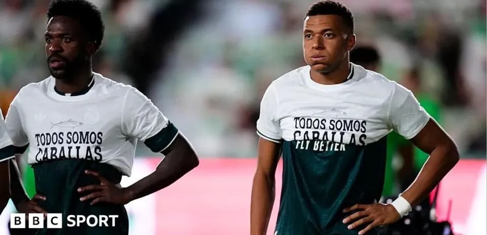 Players wearing warm-up shirts before the match