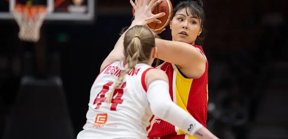 Player passing the ball during a basketball game