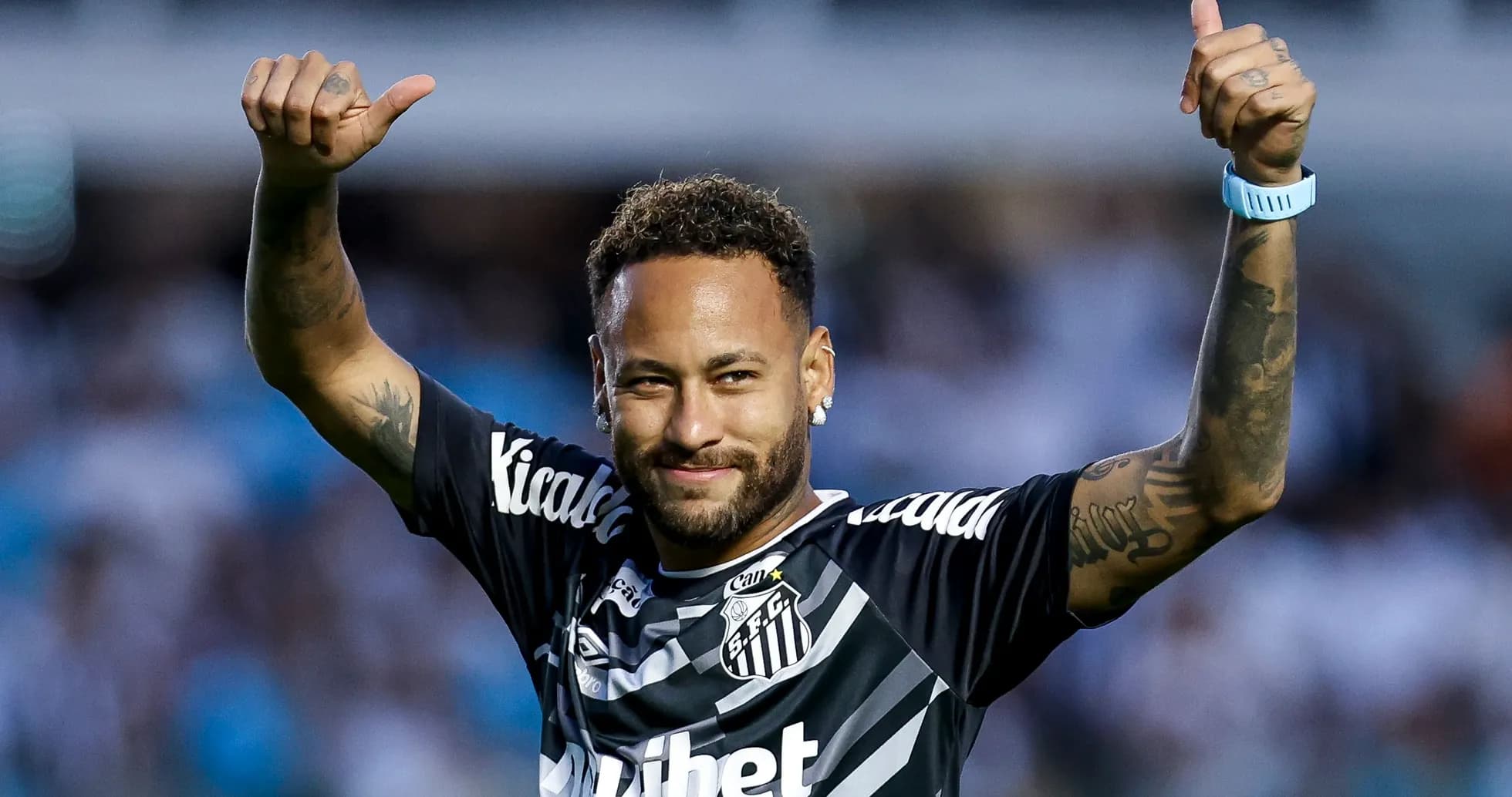 Player celebrating with thumbs up at stadium