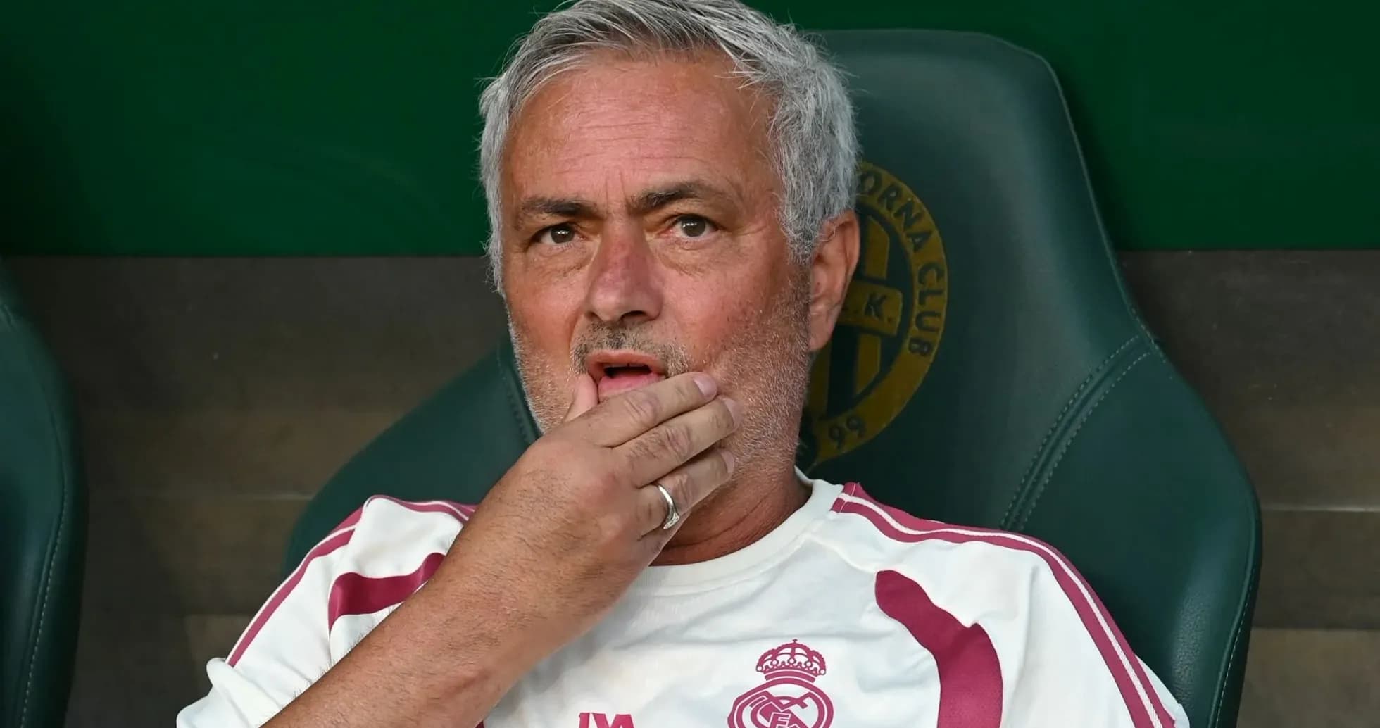 Coach sitting on bench during a match