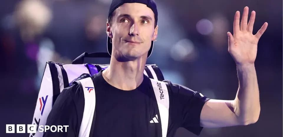 Tennis player waving with backpack on shoulder