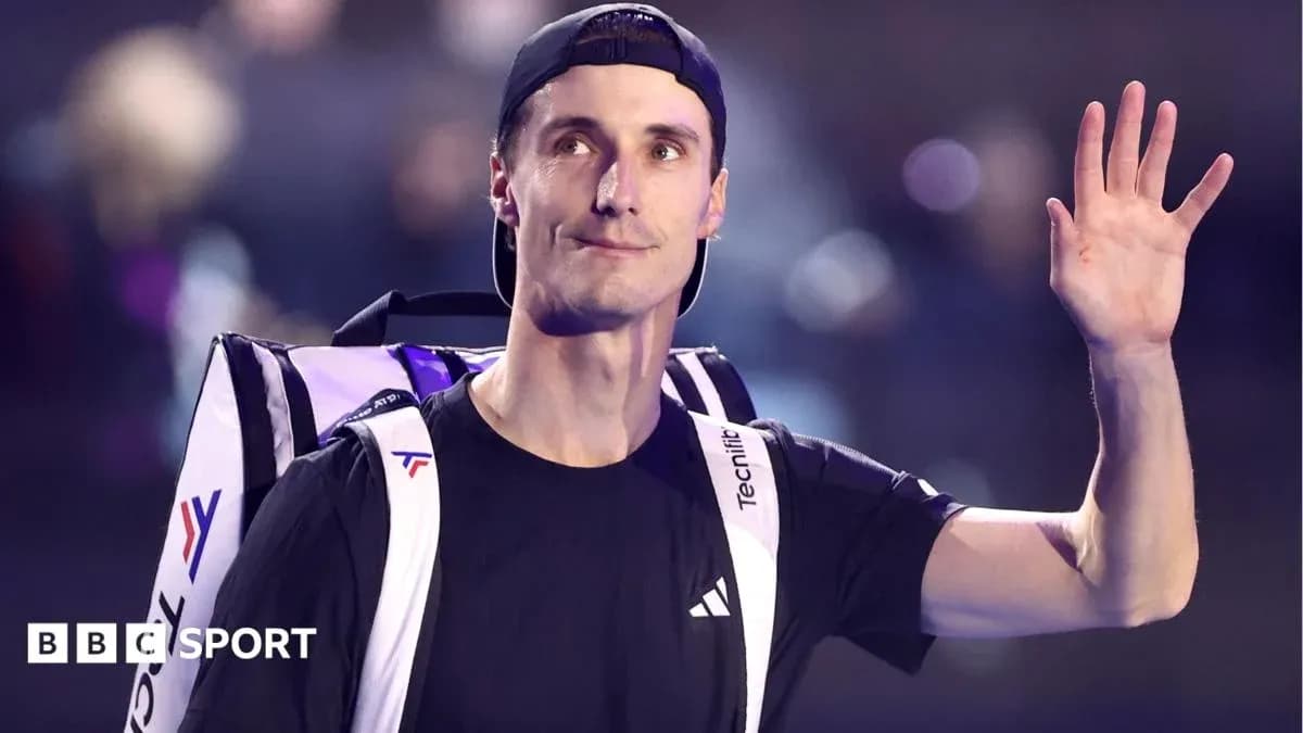Tennis player waving with backpack on shoulder
